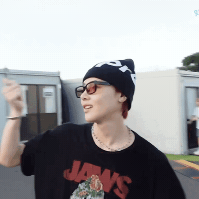 Man In Beanie And Sunglasses Wearing Jaws T-Shirt GIF