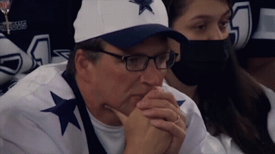 Man In Beanie And T-Shirt Holding Fist Up GIF