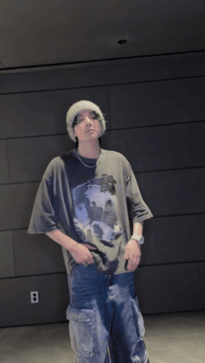 Man in Beanie and T-Shirt With Hands on Hips