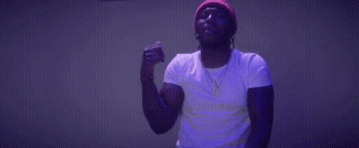 Man In Beanie Dancing In Dark Room GIF