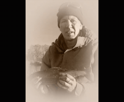 Man In Beanie Holding Large Fish GIF
