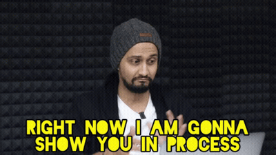 Man In Beanie Saying In Progress GIF