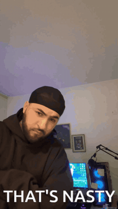 Man In Beanie Saying That's Nasty In Front Of Computer GIF