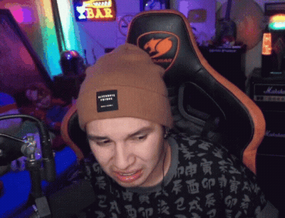 Man In Beanie Sitting In Chair With Bar Sign GIF