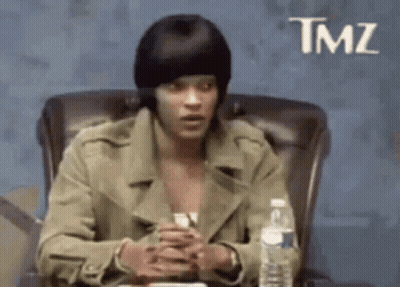 Man In Beanie Sitting With Water GIF