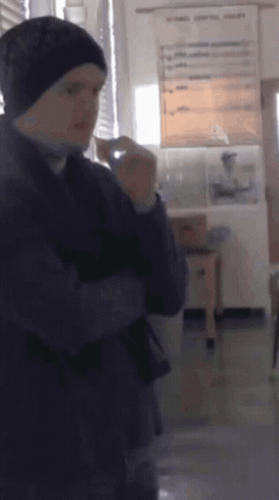 Man In Beanie Standing In Room GIF
