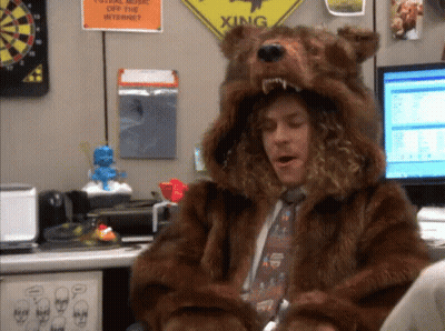 Man In Bear Costume Sitting At Computer Desk GIF