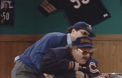 Man In Bear Hat Holding Another Man In Bar GIF