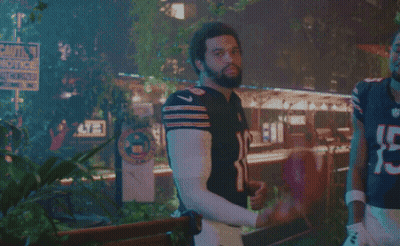 Man In Bear Jersey Next To Man In Number 15 Jersey GIF