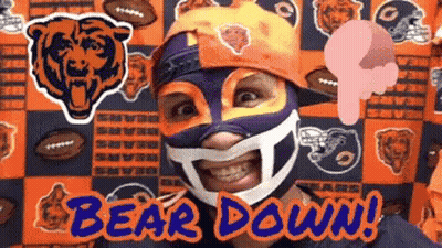 Man in Bear Mask in Front of Bear Backdrop