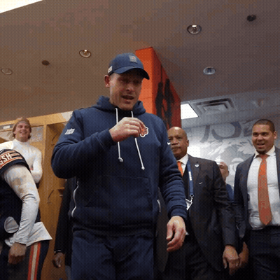 Man In Bear Sweatshirt In Locker Room GIF