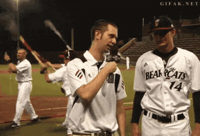 Man In Bearcats Jersey Holding Microphone GIF