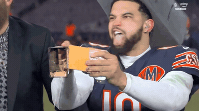 Man In Bears Jersey Holding Card GIF
