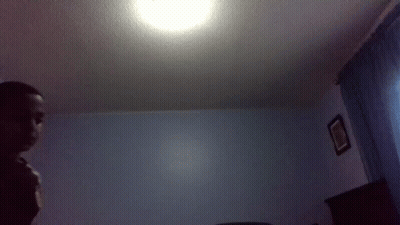 Man In Bedroom With Ceiling Light GIF