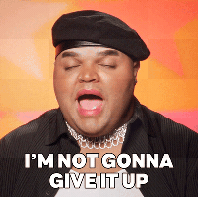Man In Beret And Choker Saying Not Giving Up GIF