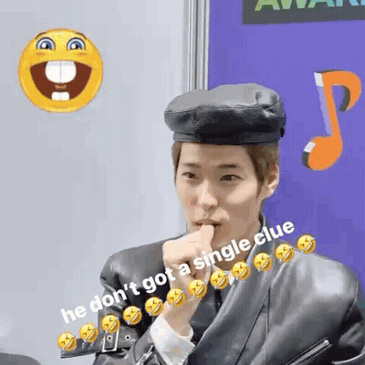 Man In Beret And Leather Jacket Holding Thumb To Mouth GIF