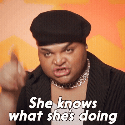 Man In Beret Saying She Knows What She's Doing GIF