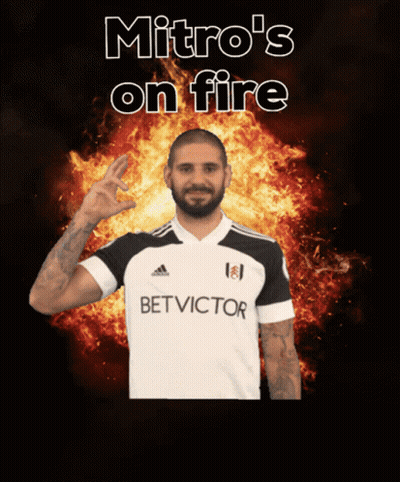 Man In Bet Victor Shirt In Front Of Flames GIF