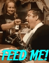 Man In Bib Feed Me GIF