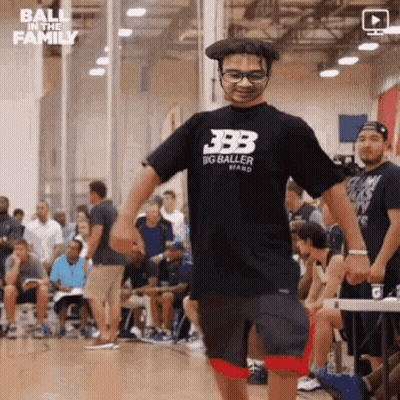 Man In Big Baller Shirt Holding Hands GIF
