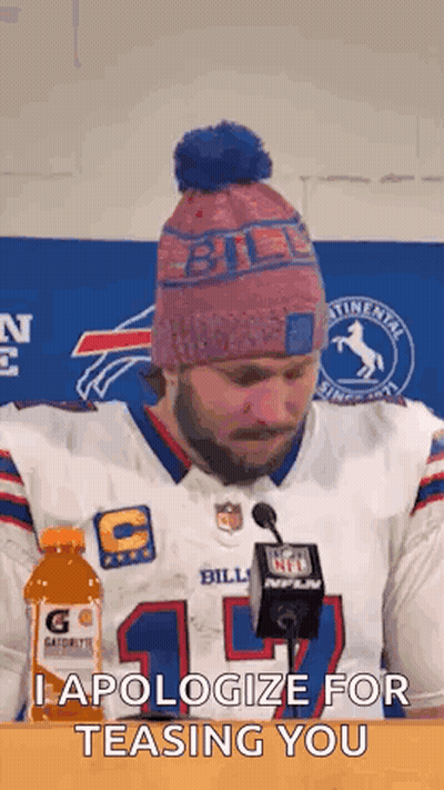 Man In Bills Jersey Sitting At Table With Gatorade And Microphone GIF