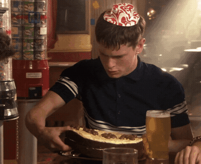 Man In Birthday Hat Holding Cake GIF