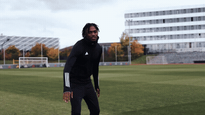 Man In Black Adidas Hoodie On Soccer Field GIF