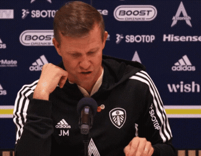 Man In Black Adidas Jacket At Microphone With Sponsors GIF