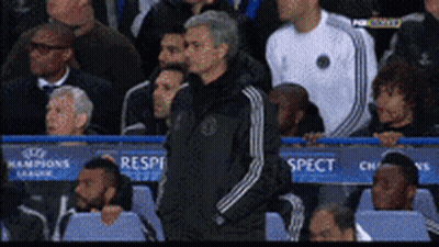 Man In Black Adidas Jacket In Front Of Champions League Sign GIF