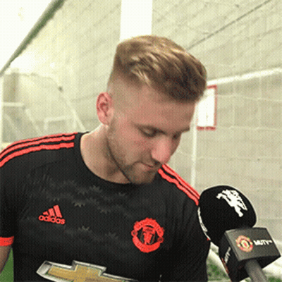Man In Black Adidas Shirt Holding Microphone GIF