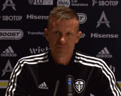 Man In Black Adidas Shirt In Front Of Sbotop Sign GIF