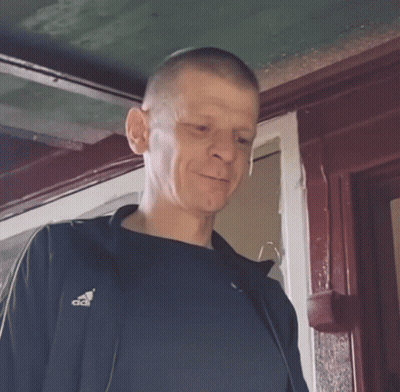 Man In Black Adidas Shirt In Front Of Window GIF