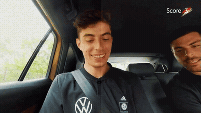 Man In Black Adidas Shirt Smiling In Car GIF