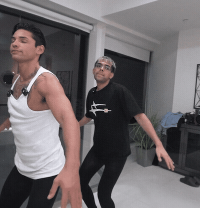 Man In Black Airplane Shirt Dancing With Another Man GIF