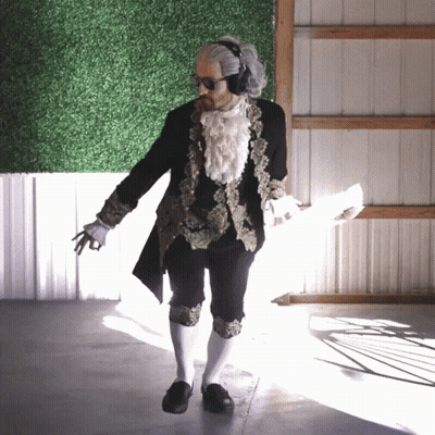 Man In Black And Gold Costume With White Socks GIF