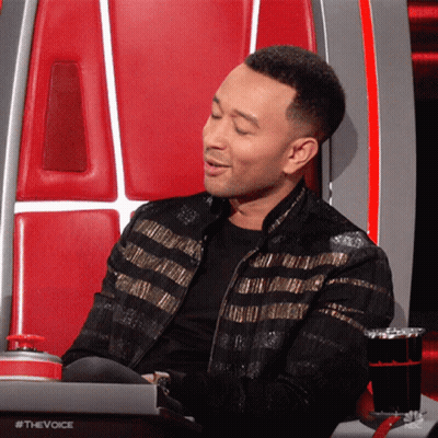 Man In Black And Gold Jacket In The Voice Chair GIF