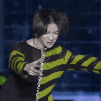 Man In Black And Green Striped Sweater Dancing GIF