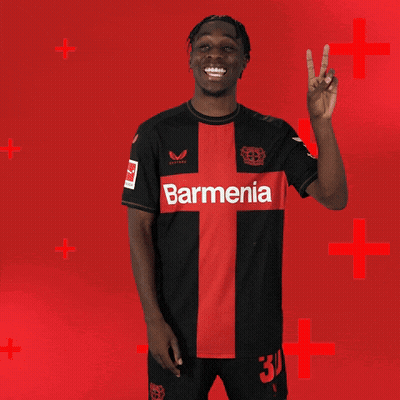 Man In Black And Red Barmenia Jersey Giving Peace Sign GIF