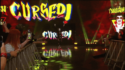 Man In Black And Red Walking Stage Cursed GIF