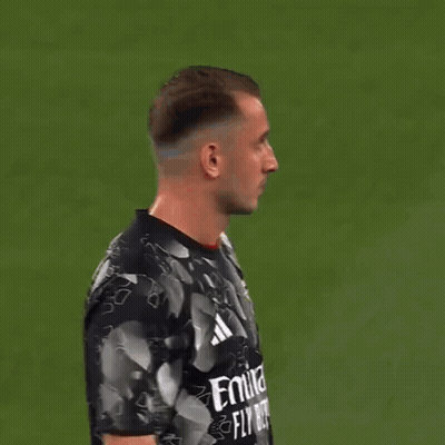 Man In Black And White Adidas Shirt Looking At Camera GIF