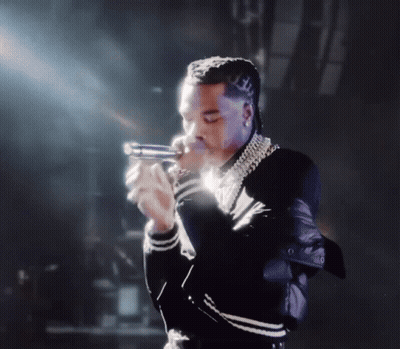 Man In Black And White Jacket Holding Gun GIF
