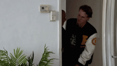 Man In Black And White Jacket With Letter F GIF