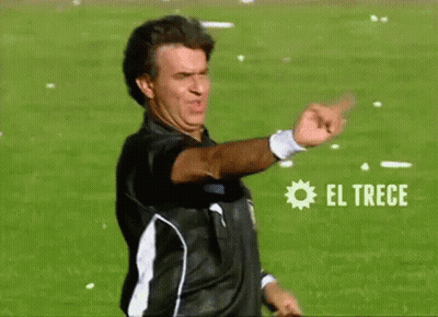 Man In Black And White Shirt Pointing At El Trece GIF