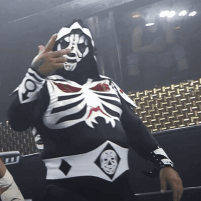 Man In Black And White Skeleton Costume Holding Up Hand GIF
