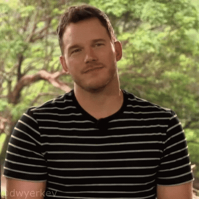 Man In Black And White Striped Shirt Smiling GIF