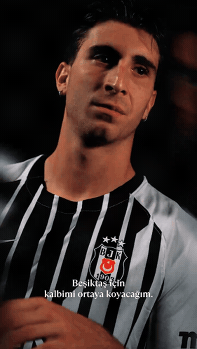 Man In Black And White Striped Shirt With BJK GIF