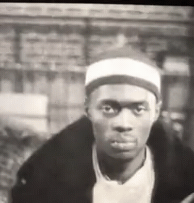 Man In Black And White With White Headband And Black Jacket GIF