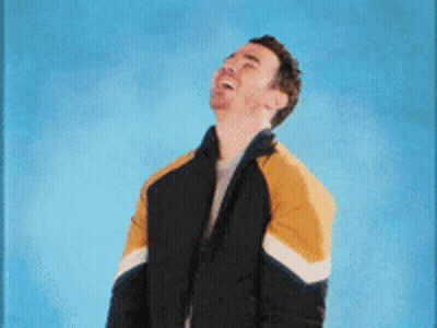 Man In Black And Yellow Jacket Making Funny Face GIF