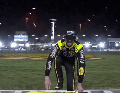 Man In Black And Yellow Outfit With Carden GIF