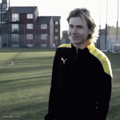 Man In Black And Yellow Puma Jacket GIF